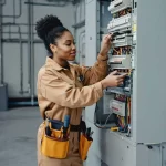 A woman working as a power technician